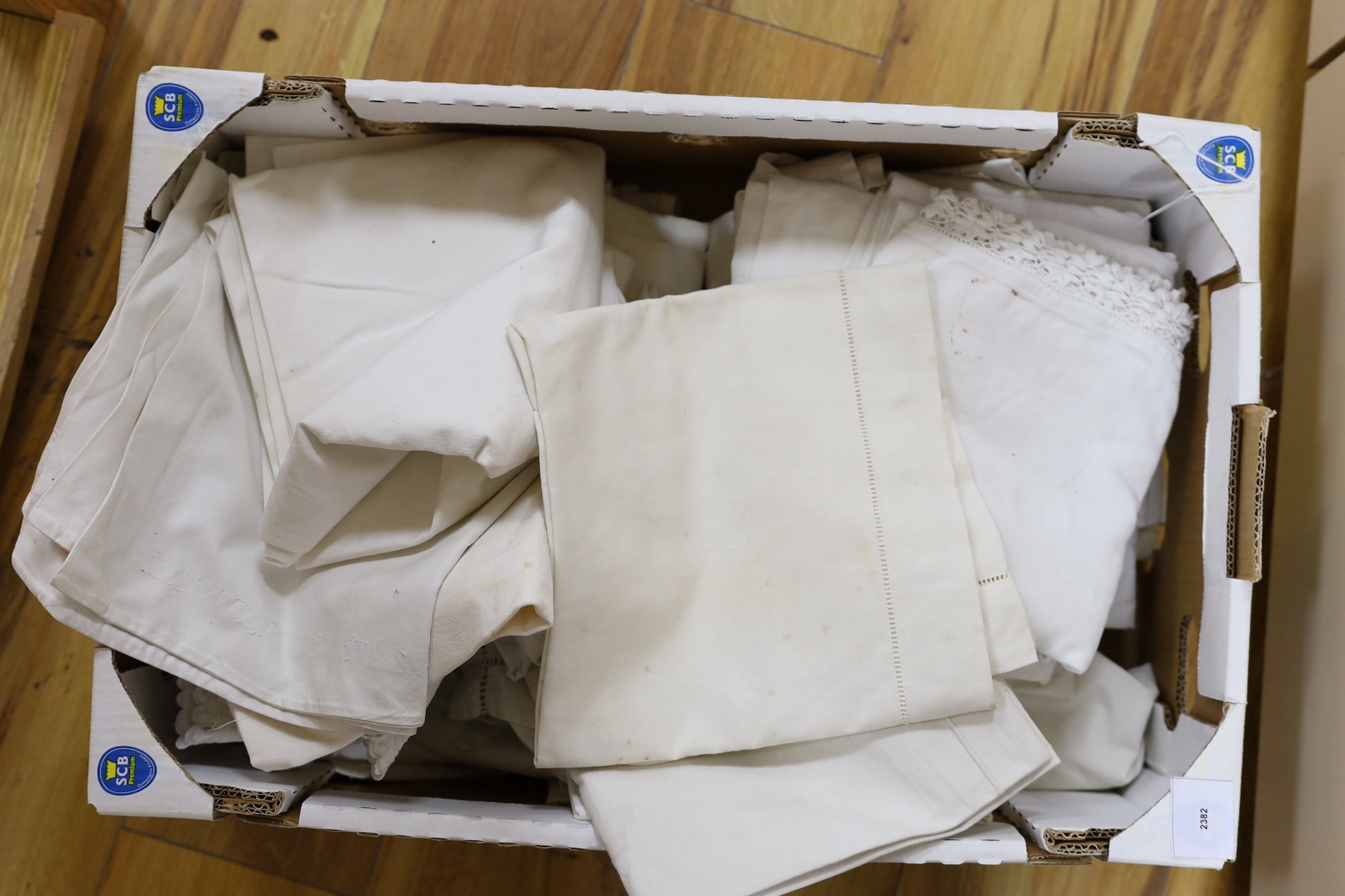 A box of French Provincial linen embroidered pillowcases